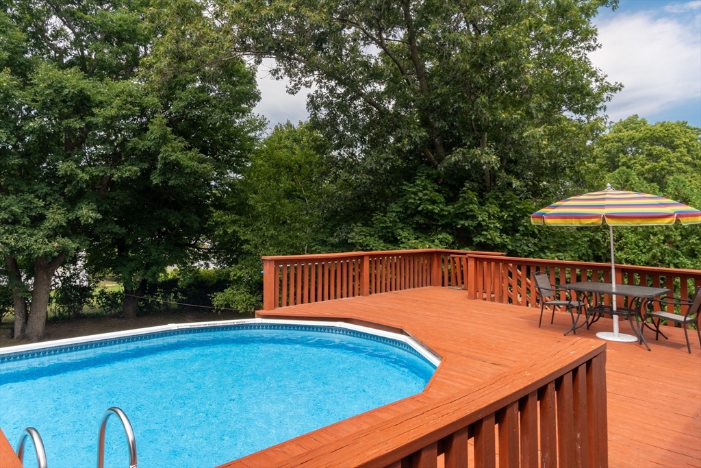 68 Sawmill Road Springfield, MA 01118 - Photo 18 of 25 a view of a balcony with chair and table