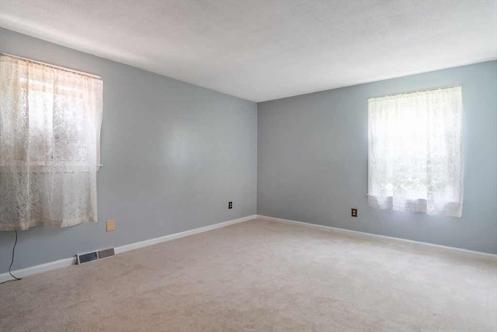 68 Sawmill Road Springfield, MA 01118 - Photo 9 of 25 a view of an empty room with a window