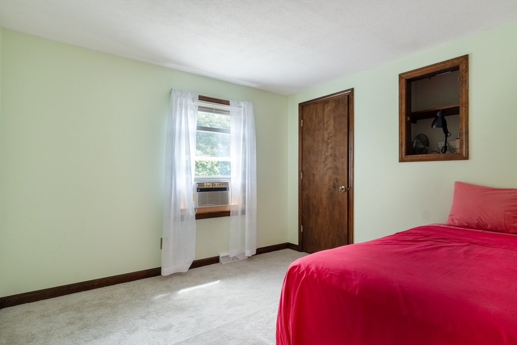 68 Sawmill Road Springfield, MA 01118 - Photo 10 of 25 a bedroom with a bed and a window