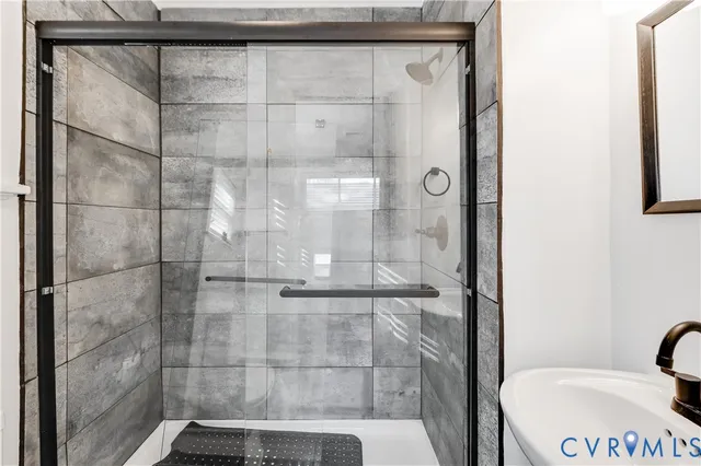 a bathroom with a sink and mirror