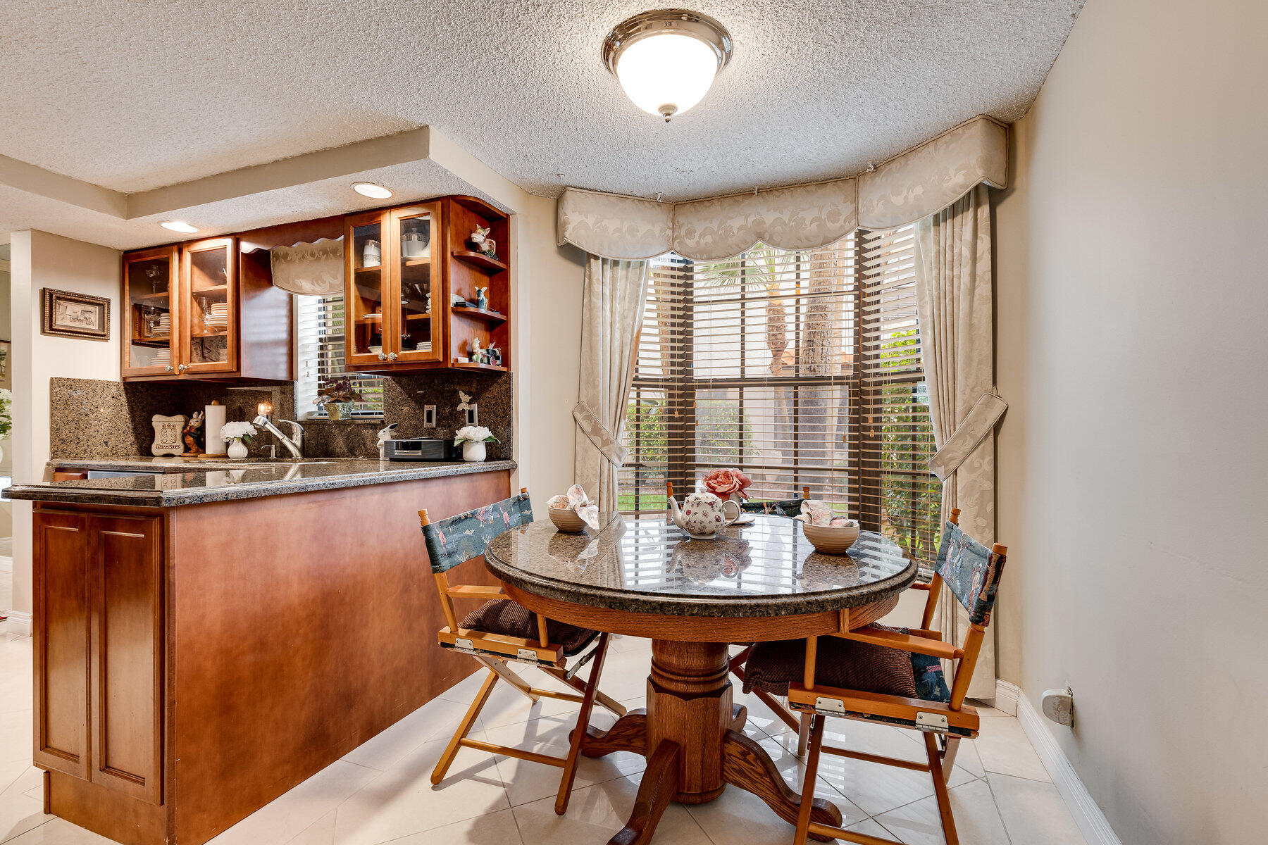7771 La Mirada Drive Boca Raton, FL 33433 - Photo 15 of 38 a dining room with furniture and window