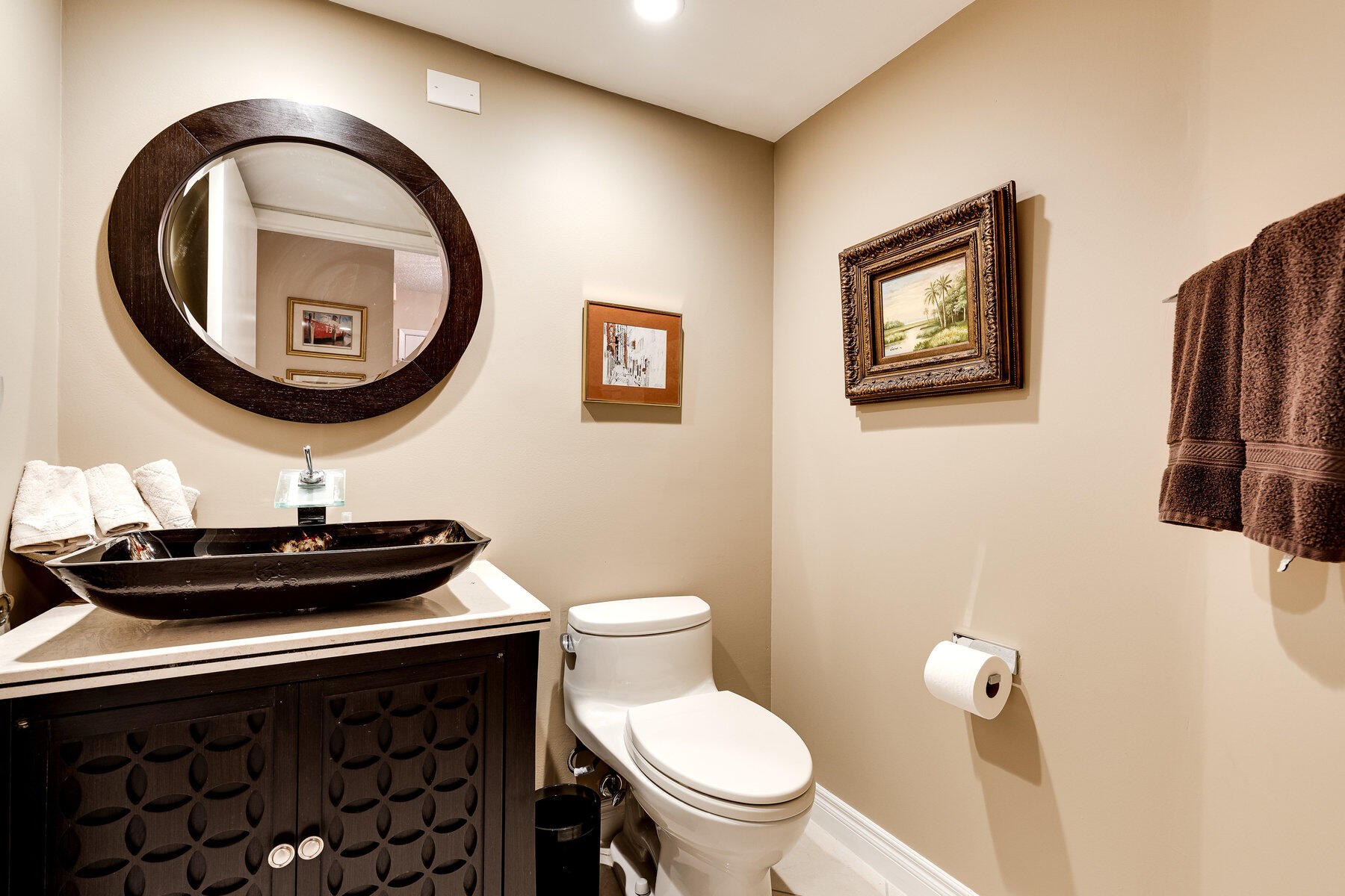 7771 La Mirada Drive Boca Raton, FL 33433 - Photo 16 of 38 a bathroom with a sink a toilet and a mirror