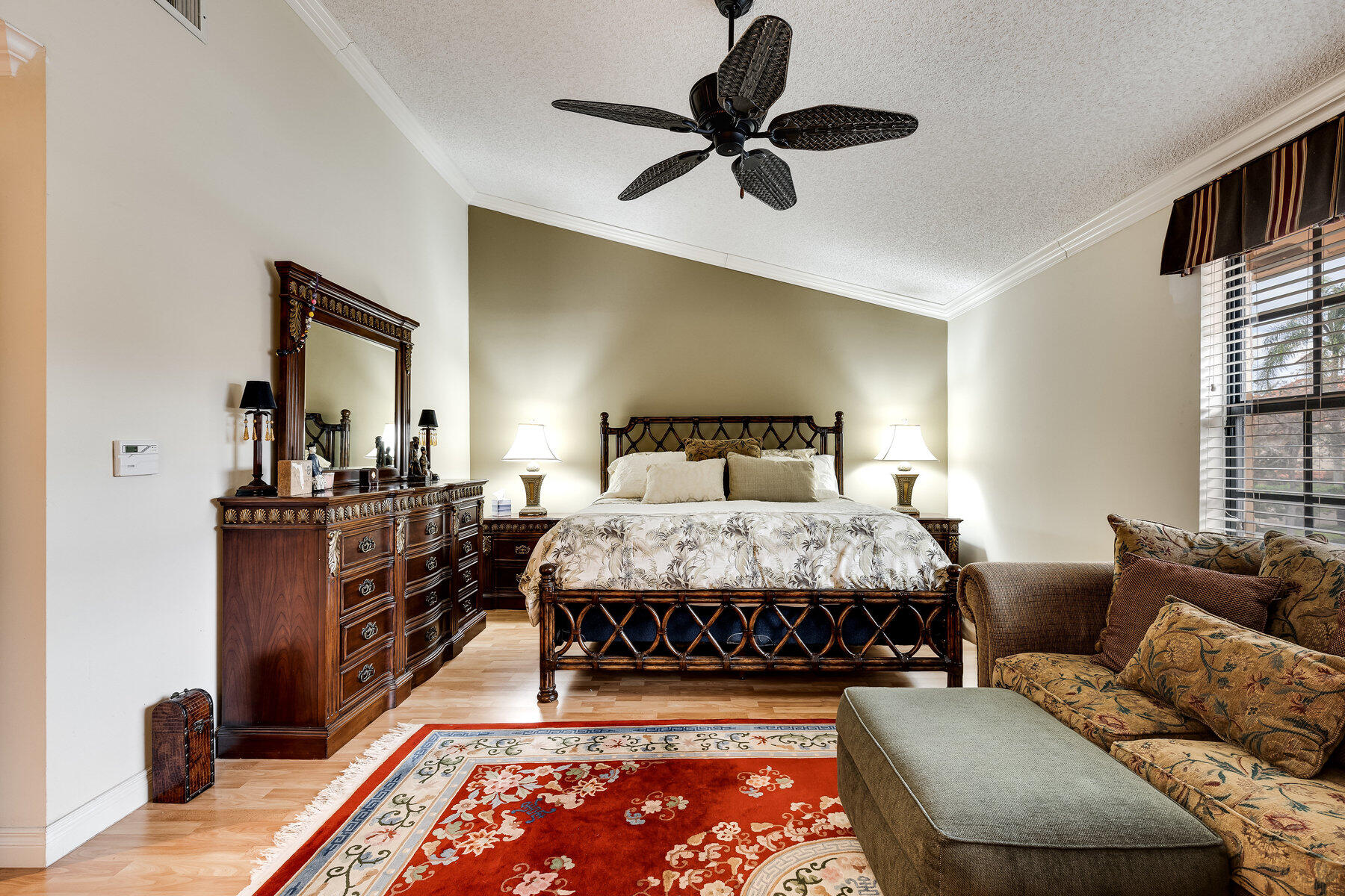 7771 La Mirada Drive Boca Raton, FL 33433 - Photo 20 of 38 a bedroom with a bed and a dresser next to a window