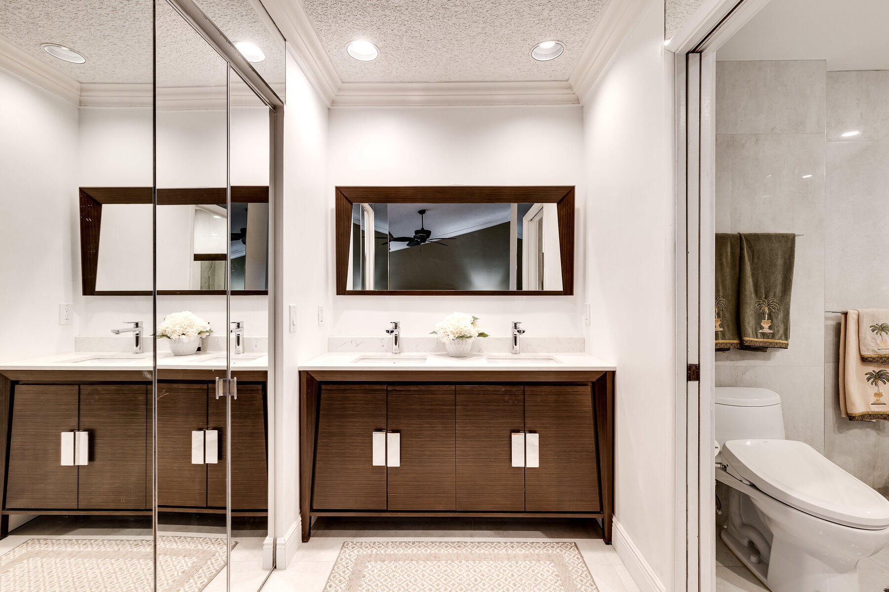 7771 La Mirada Drive Boca Raton, FL 33433 - Photo 23 of 38 a bathroom with a toilet sink and mirror