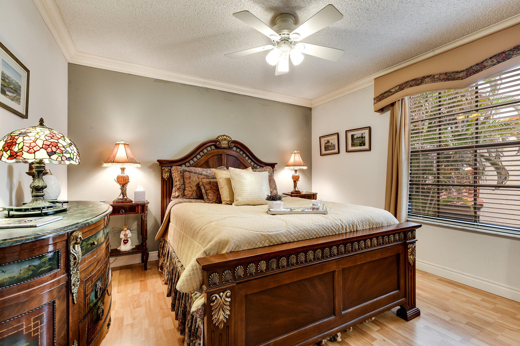 7771 La Mirada Drive Boca Raton, FL 33433 - Photo 26 of 38 a bedroom with a bed and a chandelier