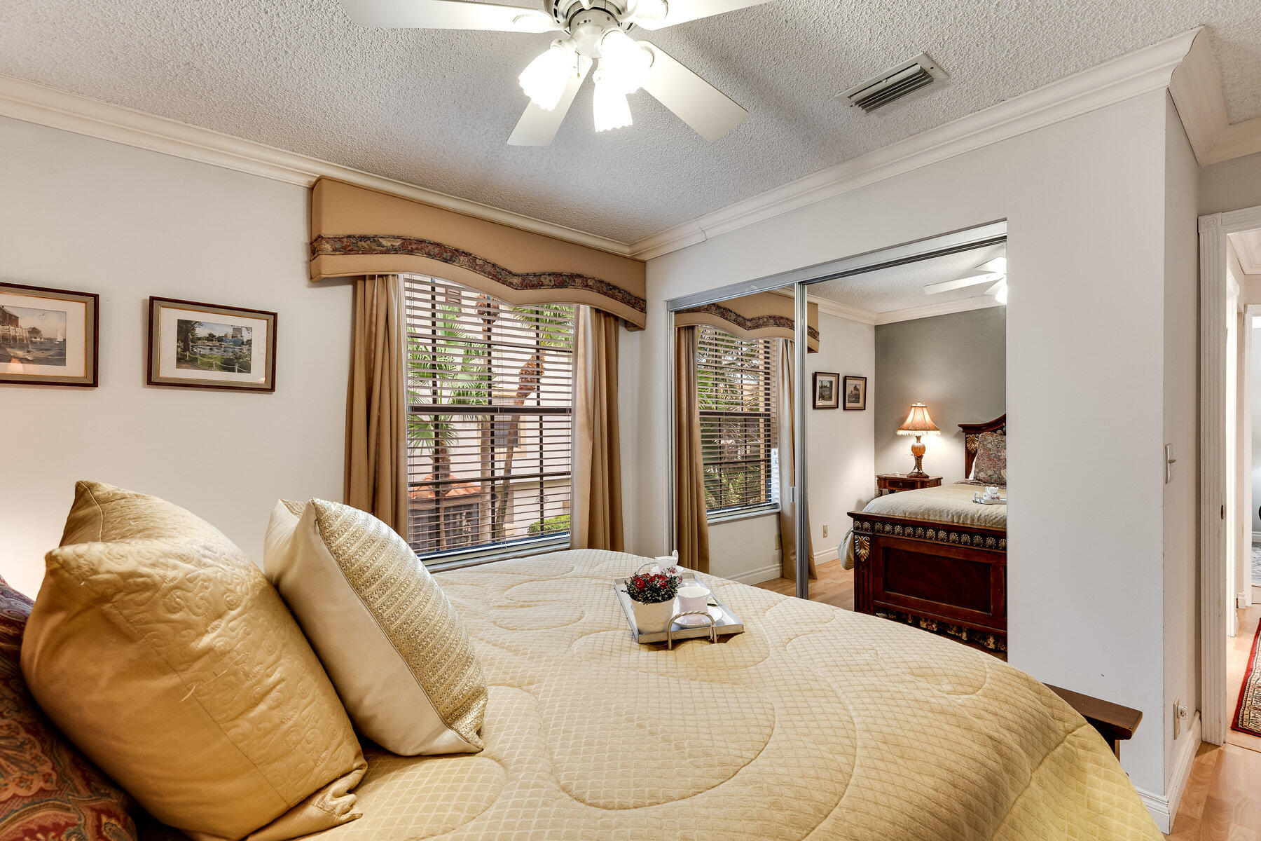 7771 La Mirada Drive Boca Raton, FL 33433 - Photo 27 of 38 a bedroom with a bed and wooden floor