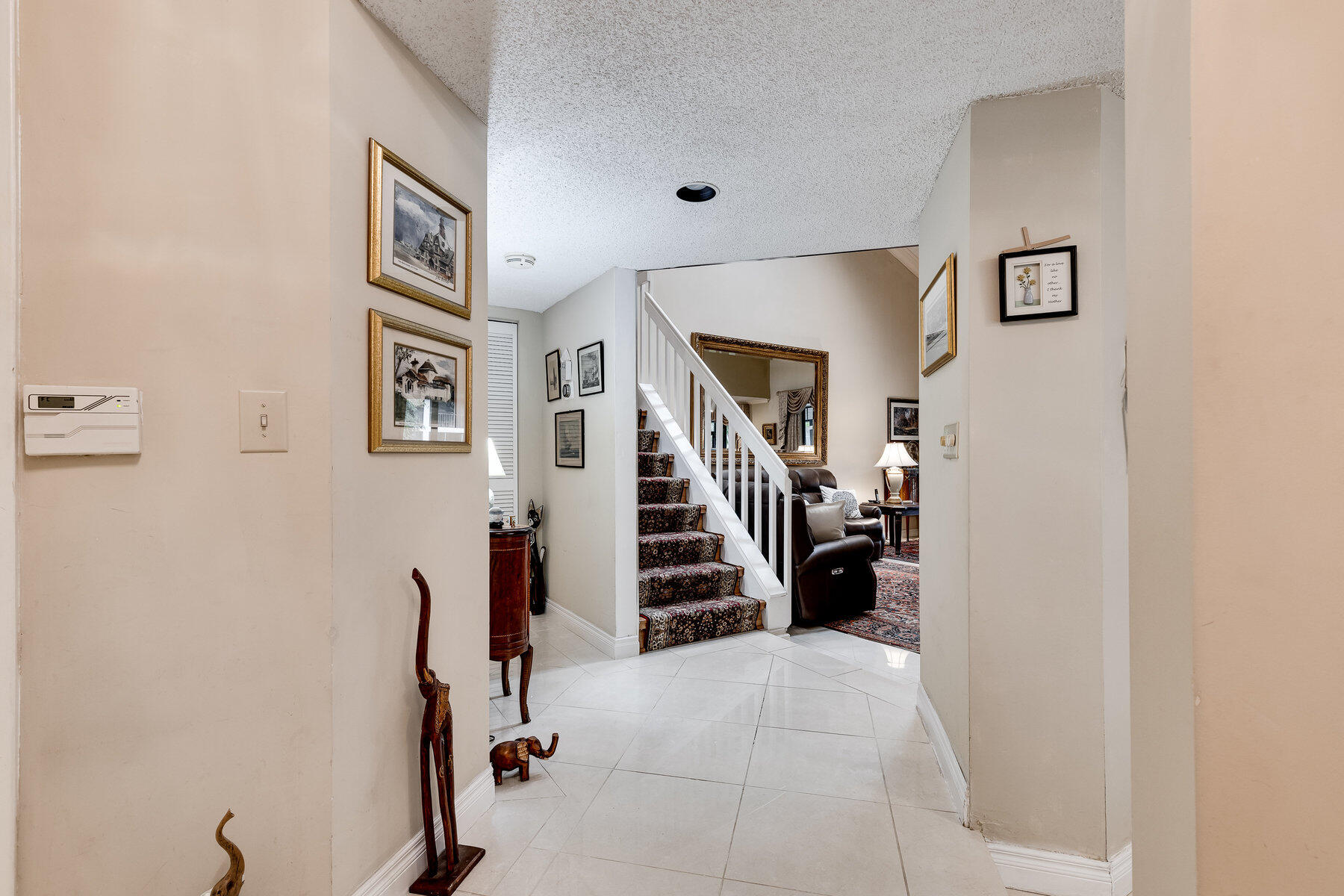 7771 La Mirada Drive Boca Raton, FL 33433 - Photo 5 of 38 a view of a livingroom with stairs