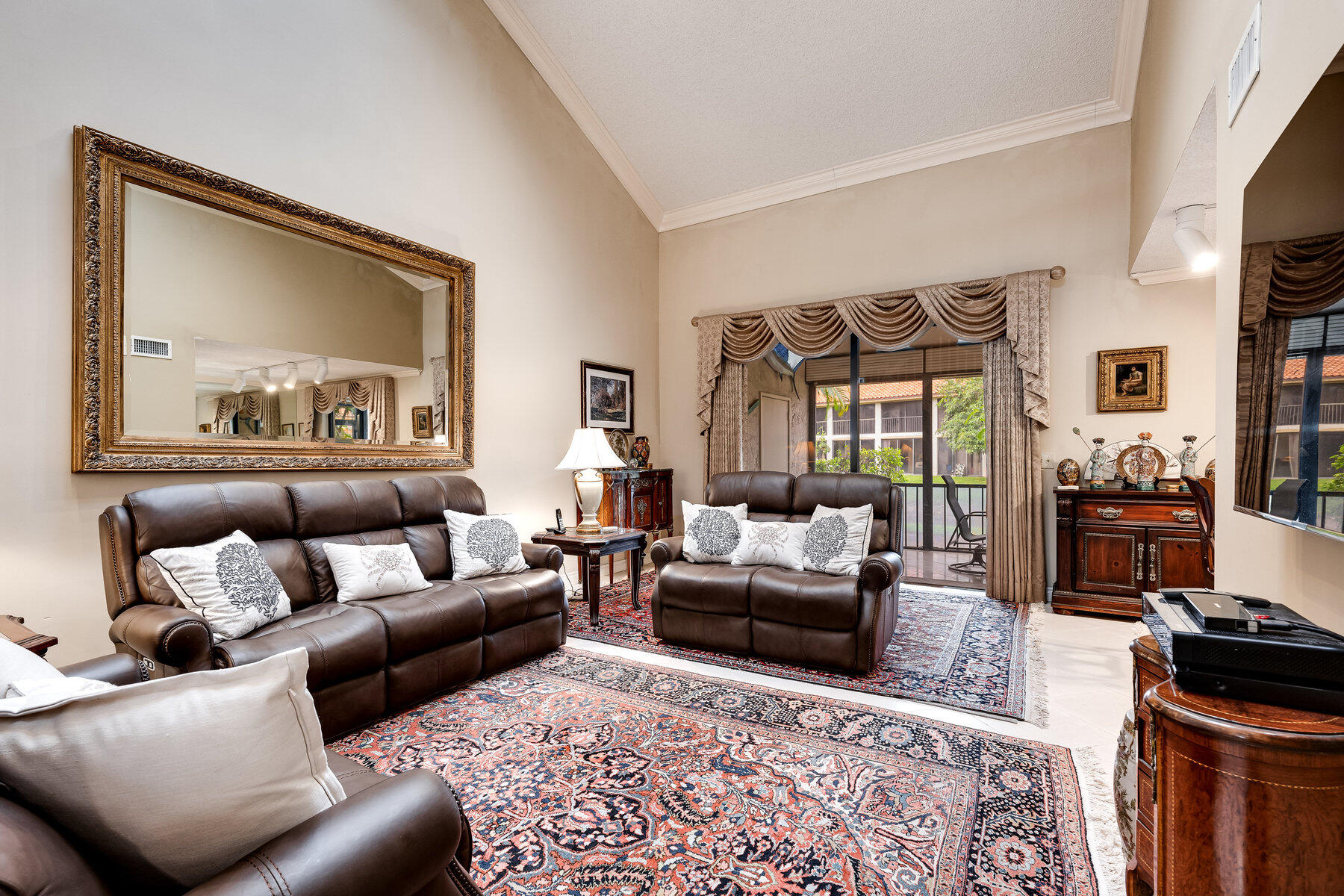 7771 La Mirada Drive Boca Raton, FL 33433 - Photo 6 of 38 a living room with furniture and a flat screen tv