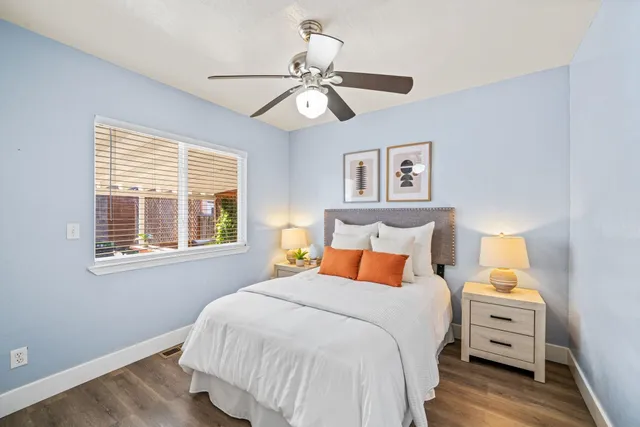 a bedroom with a bed and a window