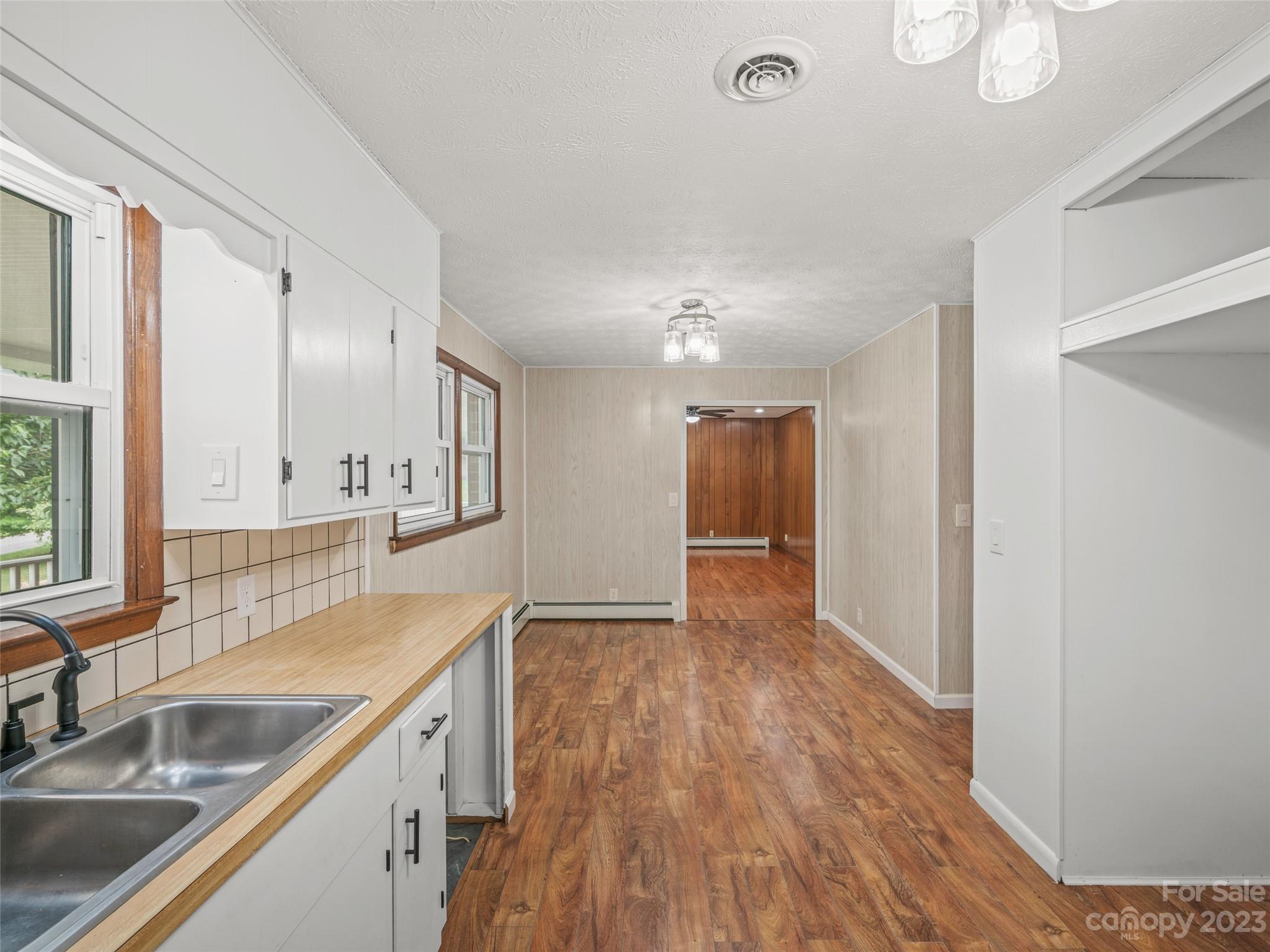 70 Letterman Road Green Mountain, NC 28740 - Photo 12 of 23 a bathroom with a sink and a large mirror