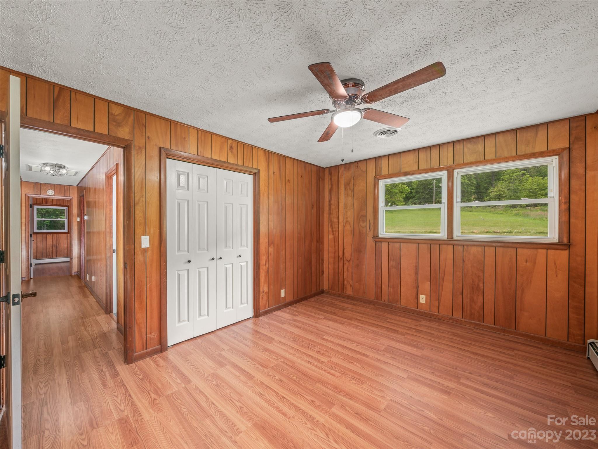 70 Letterman Road Green Mountain, NC 28740 - Photo 14 of 23 wooden floor in an empty room with a window