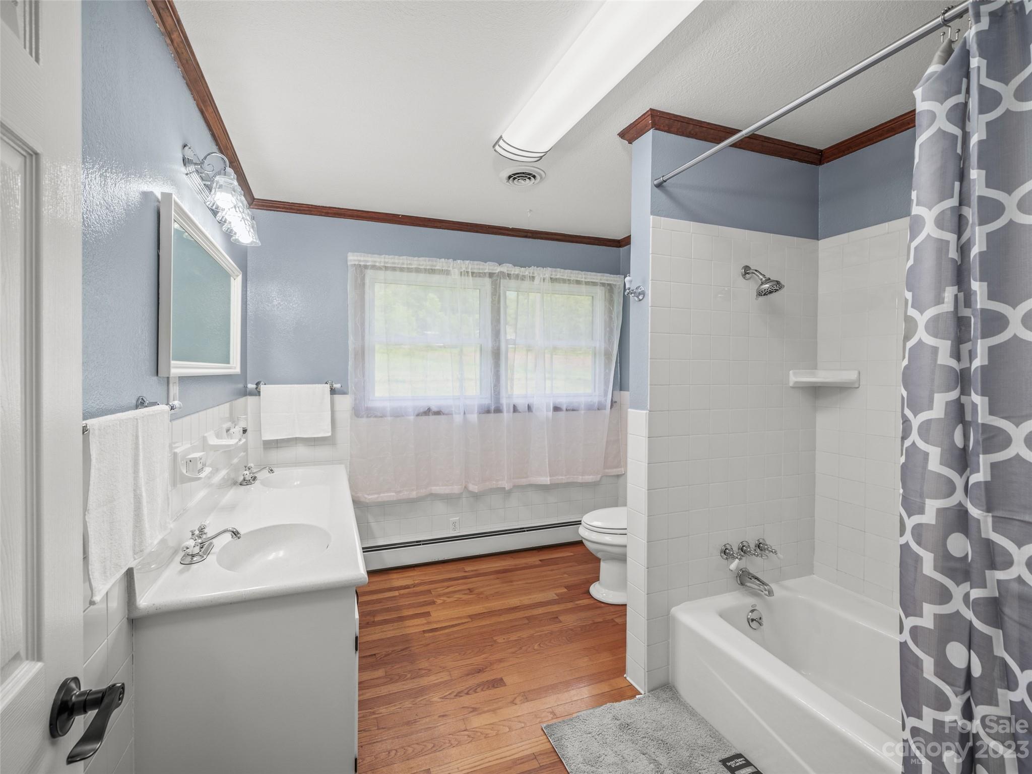 70 Letterman Road Green Mountain, NC 28740 - Photo 16 of 23 a bathroom with a bathtub shower sink and toilet