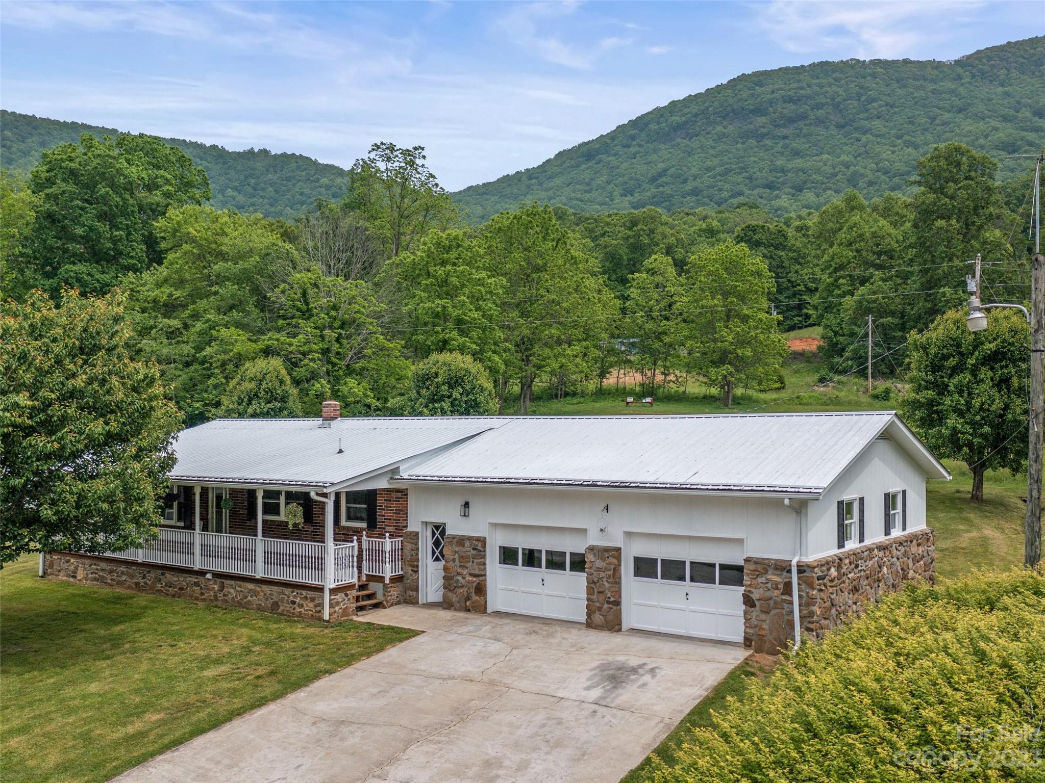 70 Letterman Road Green Mountain, NC 28740 - Photo 2 of 23 a house view with a garden space