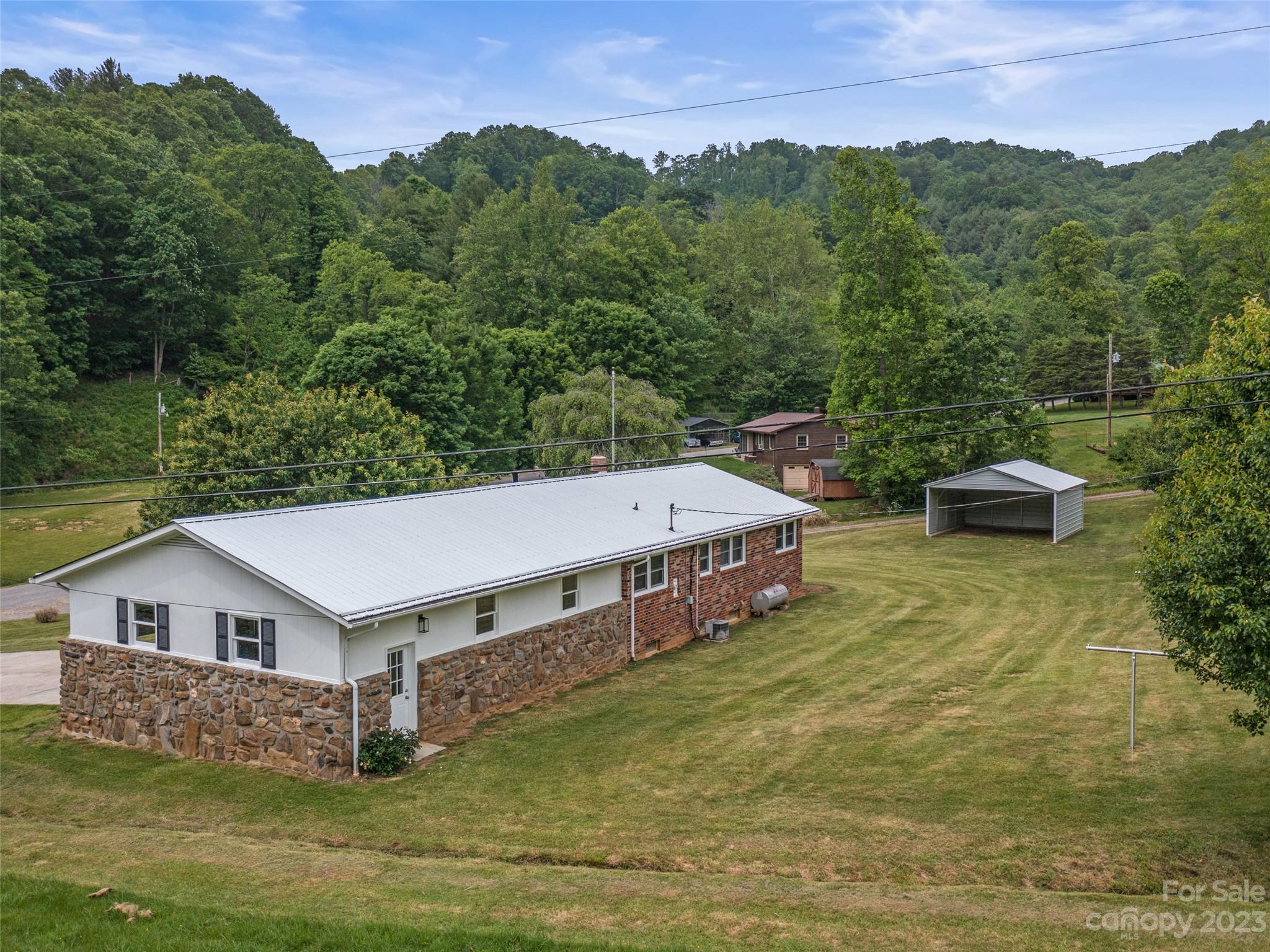 70 Letterman Road Green Mountain, NC 28740 - Photo 4 of 23 an aerial view of a house with a yard