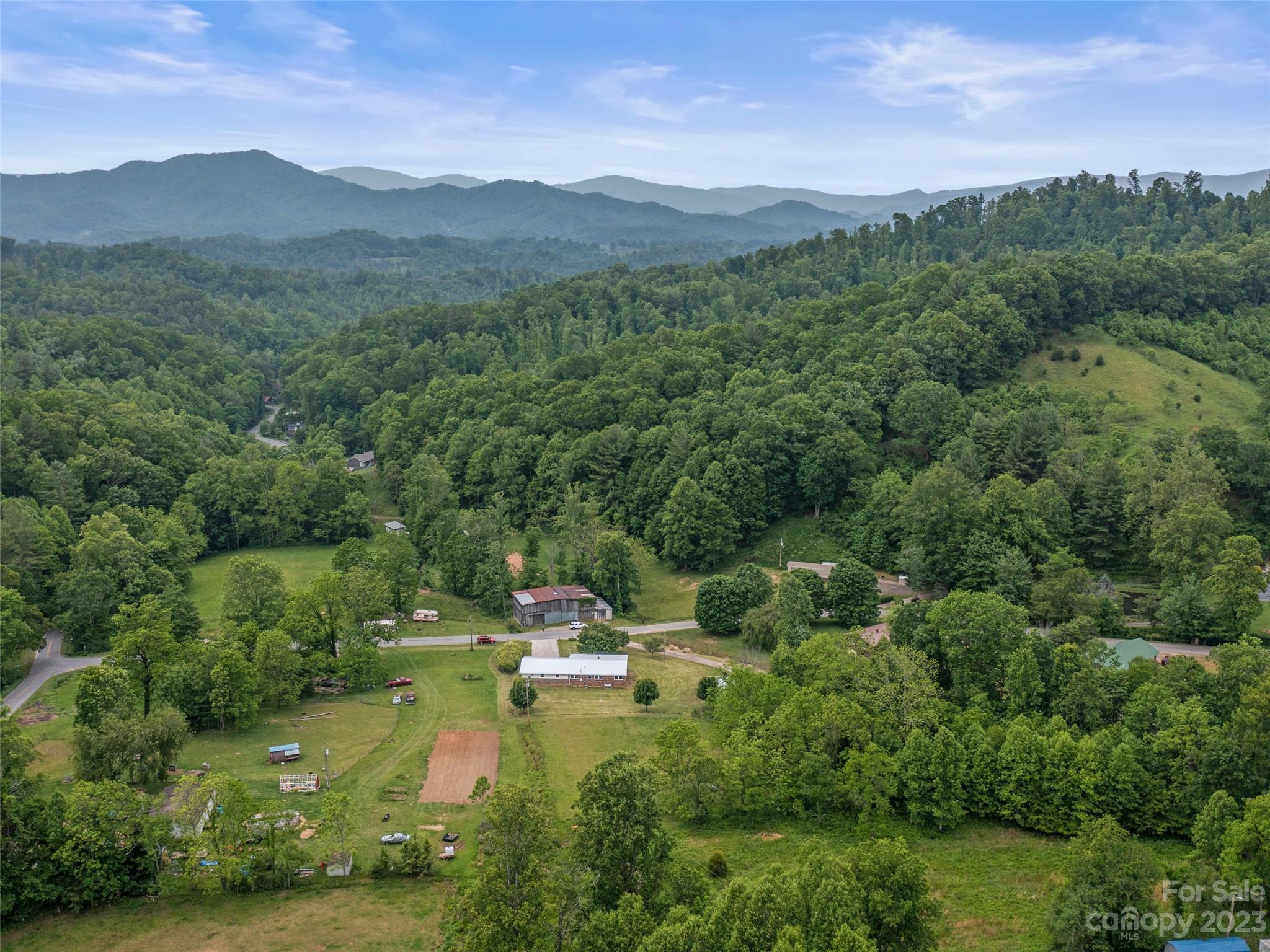 70 Letterman Road Green Mountain, NC 28740 - Photo 6 of 23 a view of a lake with mountains in the background