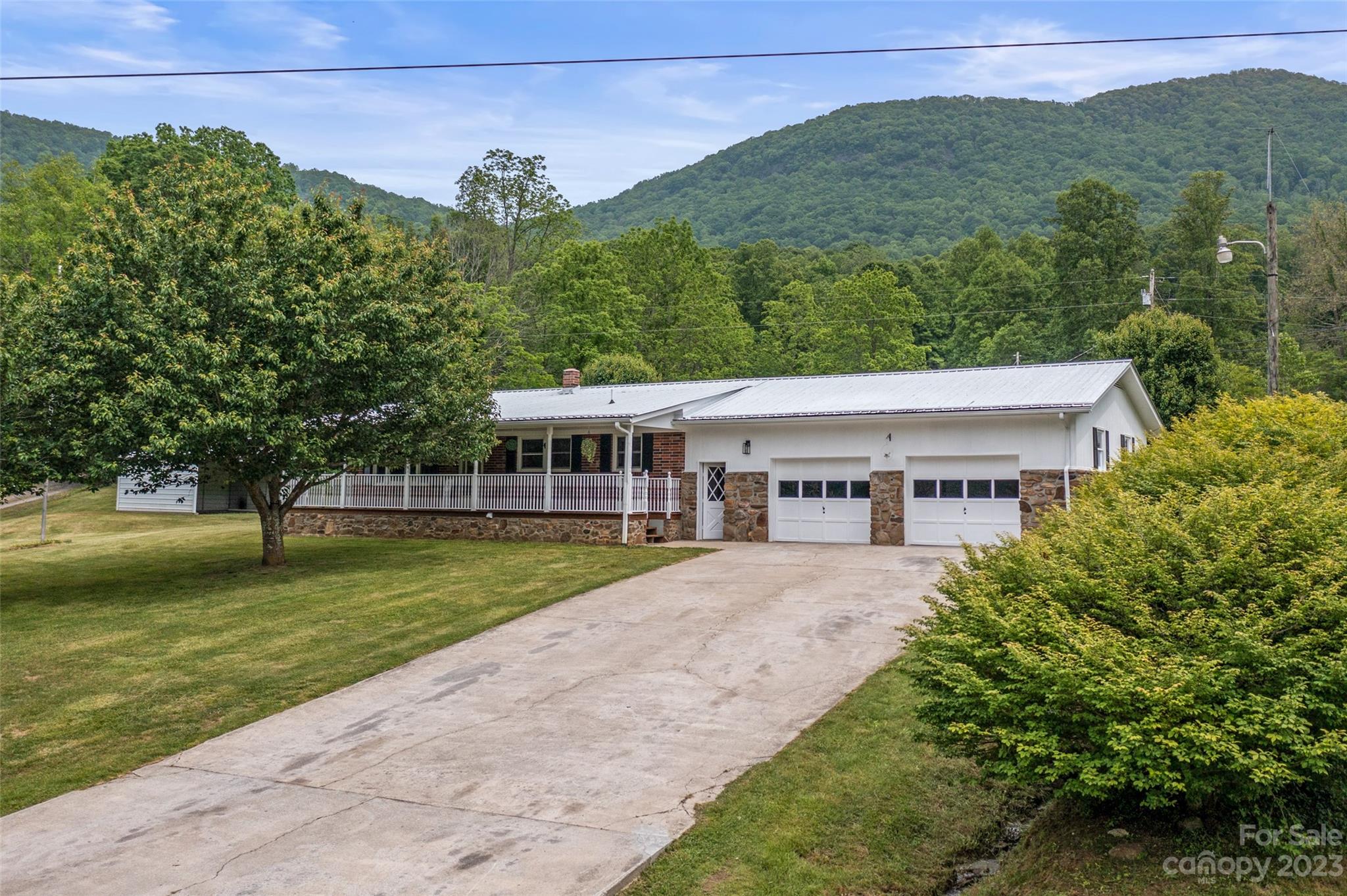70 Letterman Road Green Mountain, NC 28740 - Photo 7 of 23 a view of a house with a garden
