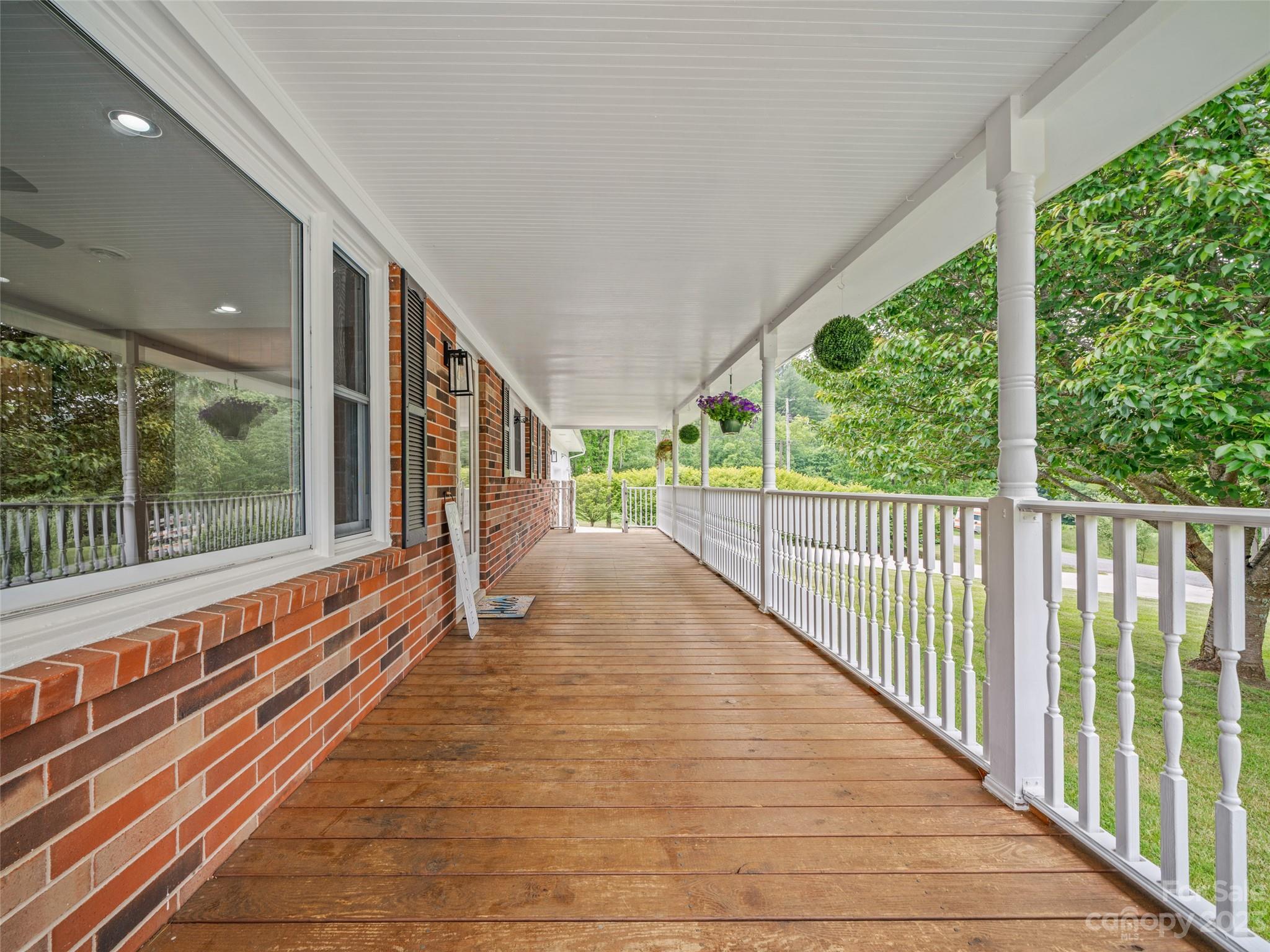 70 Letterman Road Green Mountain, NC 28740 - Photo 8 of 23 a view of a room with wooden floor and windows