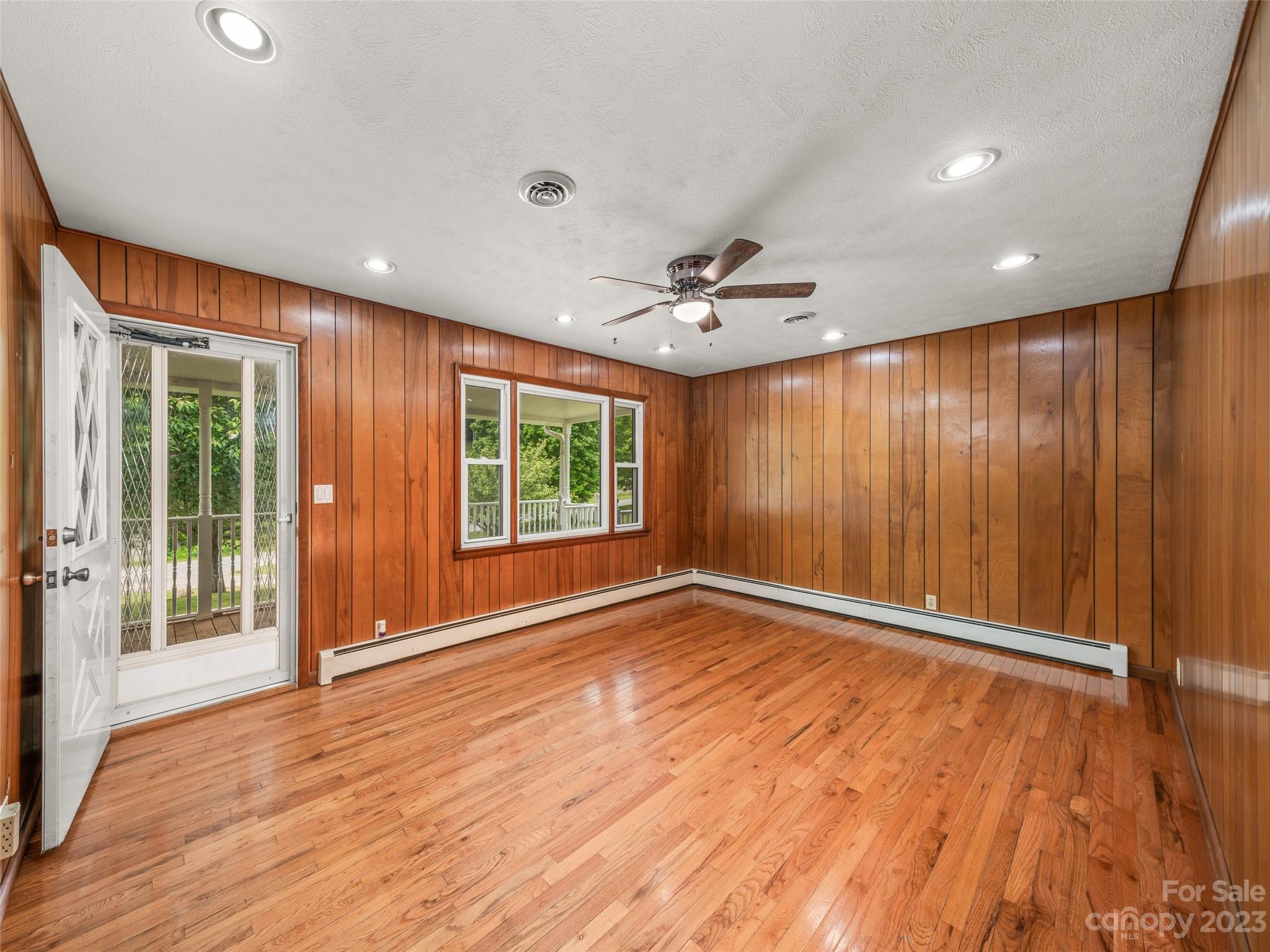 70 Letterman Road Green Mountain, NC 28740 - Photo 9 of 23 a view of an empty room with a window and wooden floor