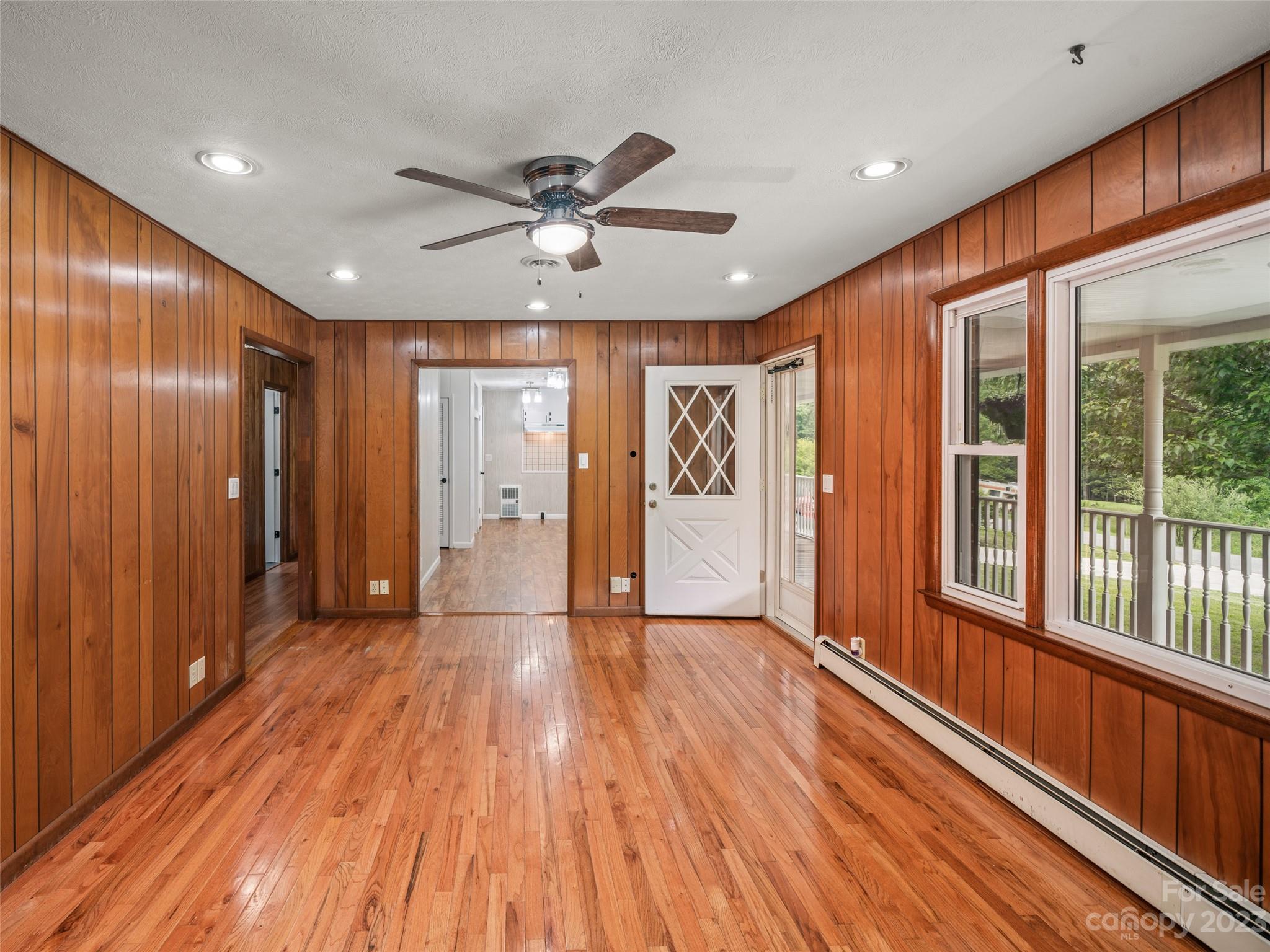 70 Letterman Road Green Mountain, NC 28740 - Photo 10 of 23 a view of an empty room with wooden floor and a window