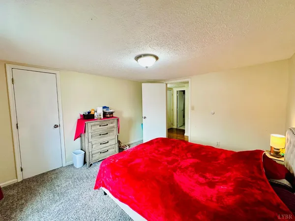 a bedroom with a bed and a closet