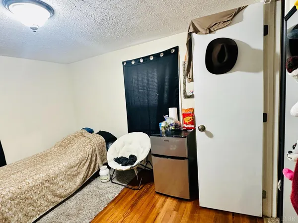 a bedroom with a bed and cabinets
