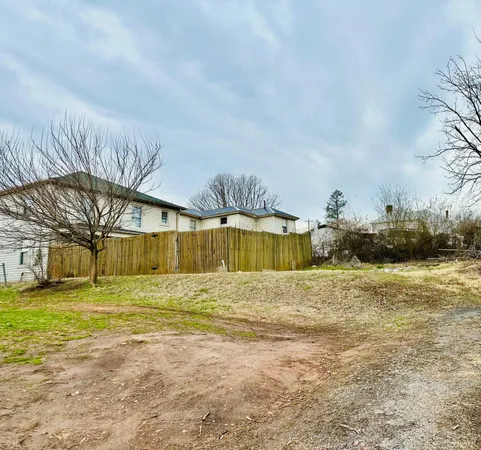 a view of a backyard of the house