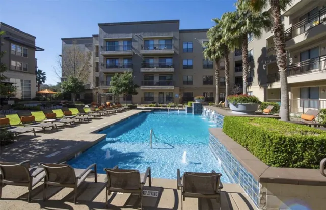a outdoor living space with patio furniture and a fire pit
