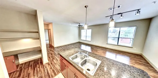a view of a living room with a fireplace