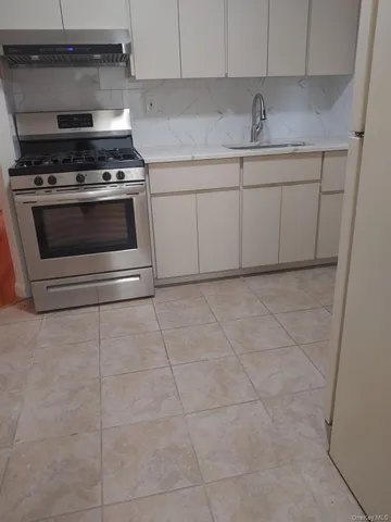 a kitchen with cabinets and appliances