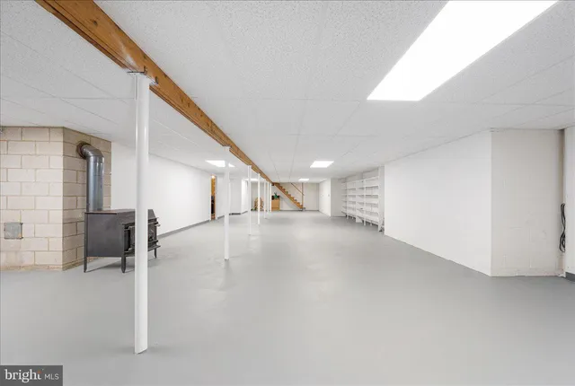 a front view of house with yard and swimming pool