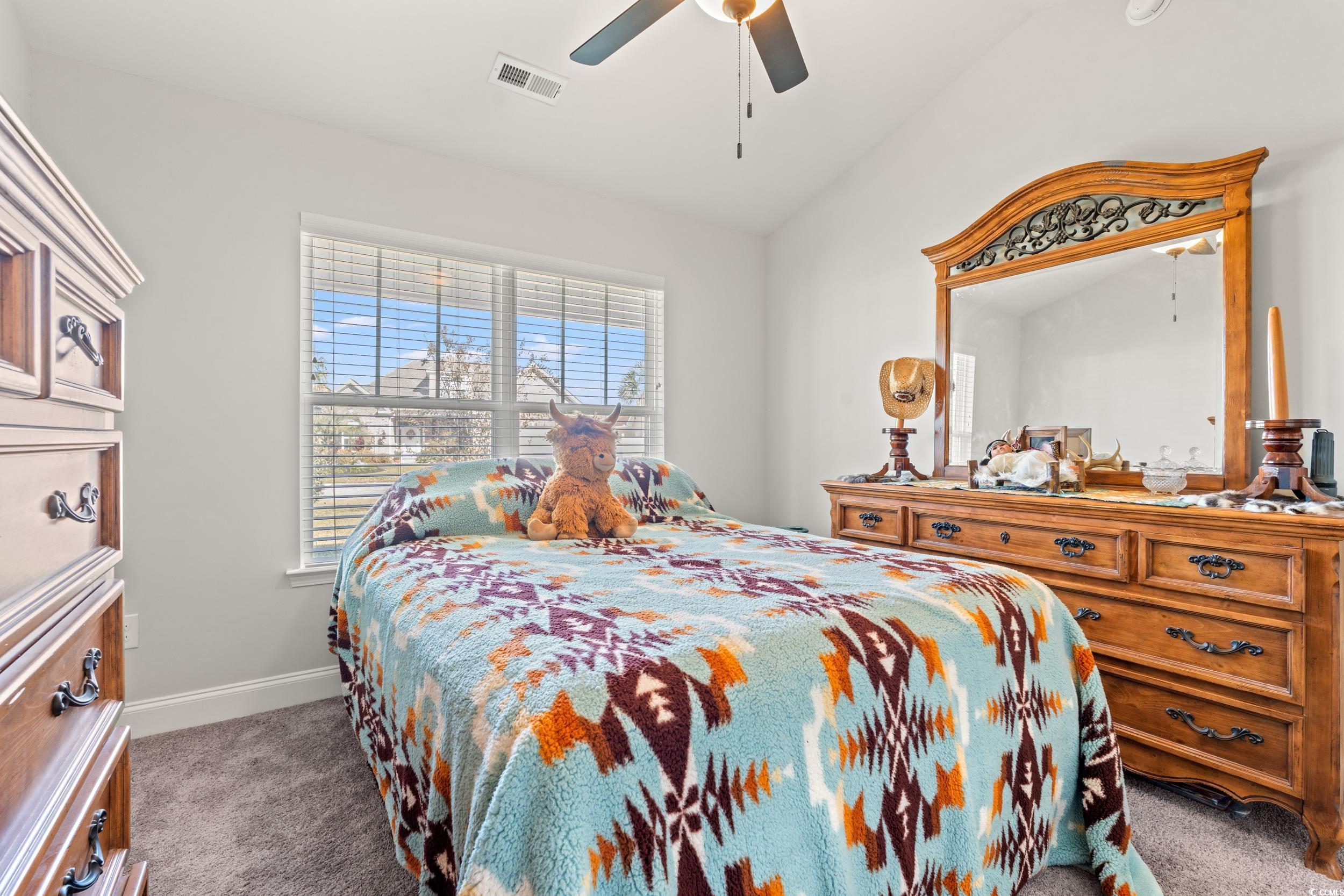 132 Fox Den Drive Murrells Inlet, SC 29576 - Photo 13 of 35 Carpeted bedroom featuring lofted ceiling and a ceiling fan