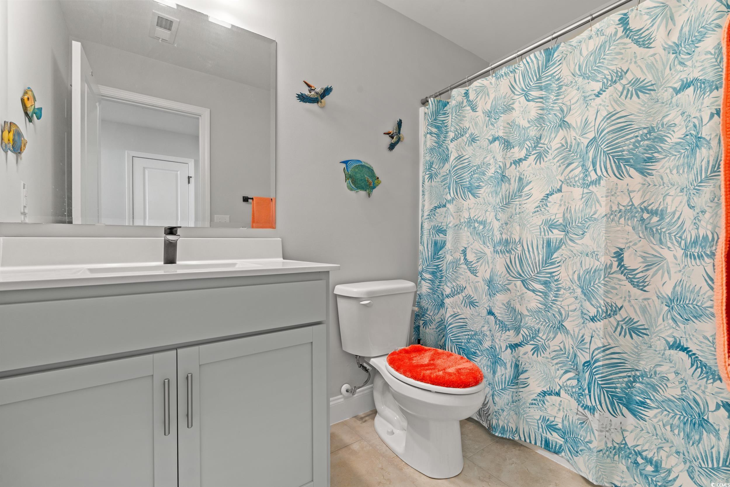 132 Fox Den Drive Murrells Inlet, SC 29576 - Photo 15 of 35 Bathroom with vanity, a shower with shower curtain, and light tile patterned floors