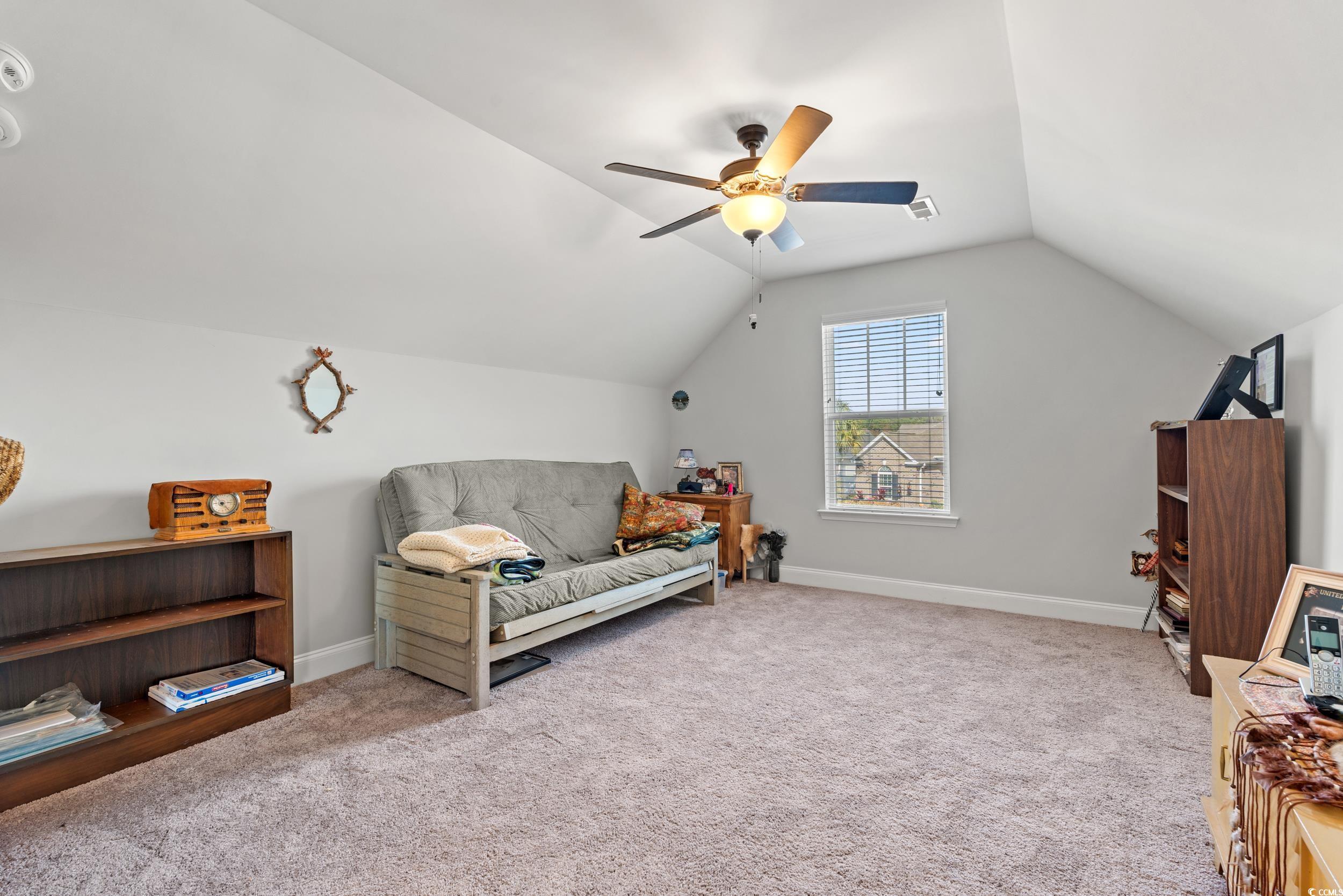132 Fox Den Drive Murrells Inlet, SC 29576 - Photo 16 of 35 Bonus room/fourth bedroom, second floor featuring light carpet, vaulted ceiling, and ceiling fan