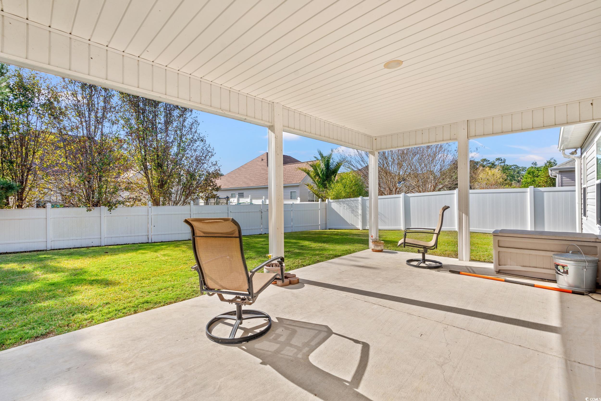 132 Fox Den Drive Murrells Inlet, SC 29576 - Photo 19 of 35 Fenced backyard featuring a patio