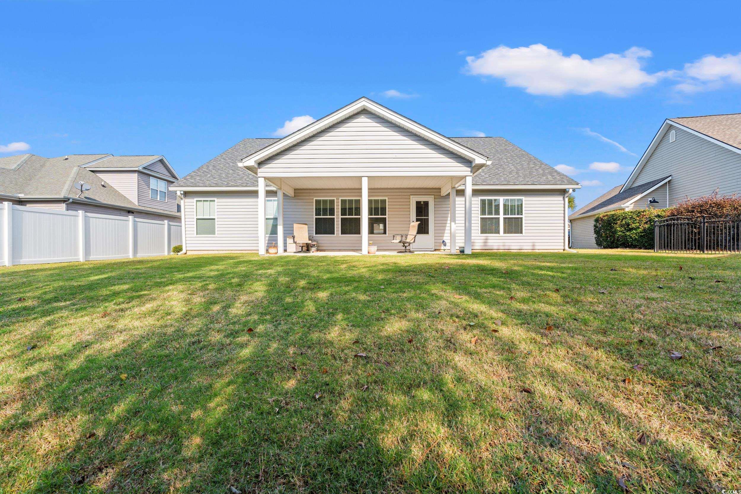 132 Fox Den Drive Murrells Inlet, SC 29576 - Photo 23 of 35 Rear view of property featuring a patio area and roof with shingles