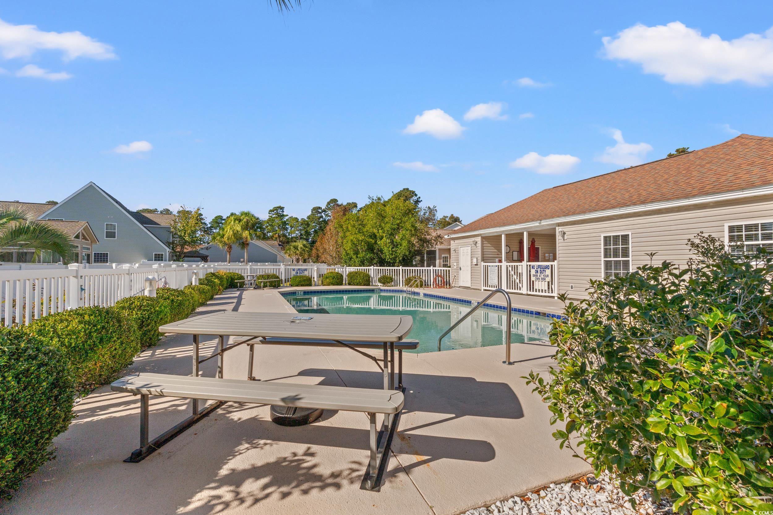 132 Fox Den Drive Murrells Inlet, SC 29576 - Photo 29 of 35 Community pool with a patio