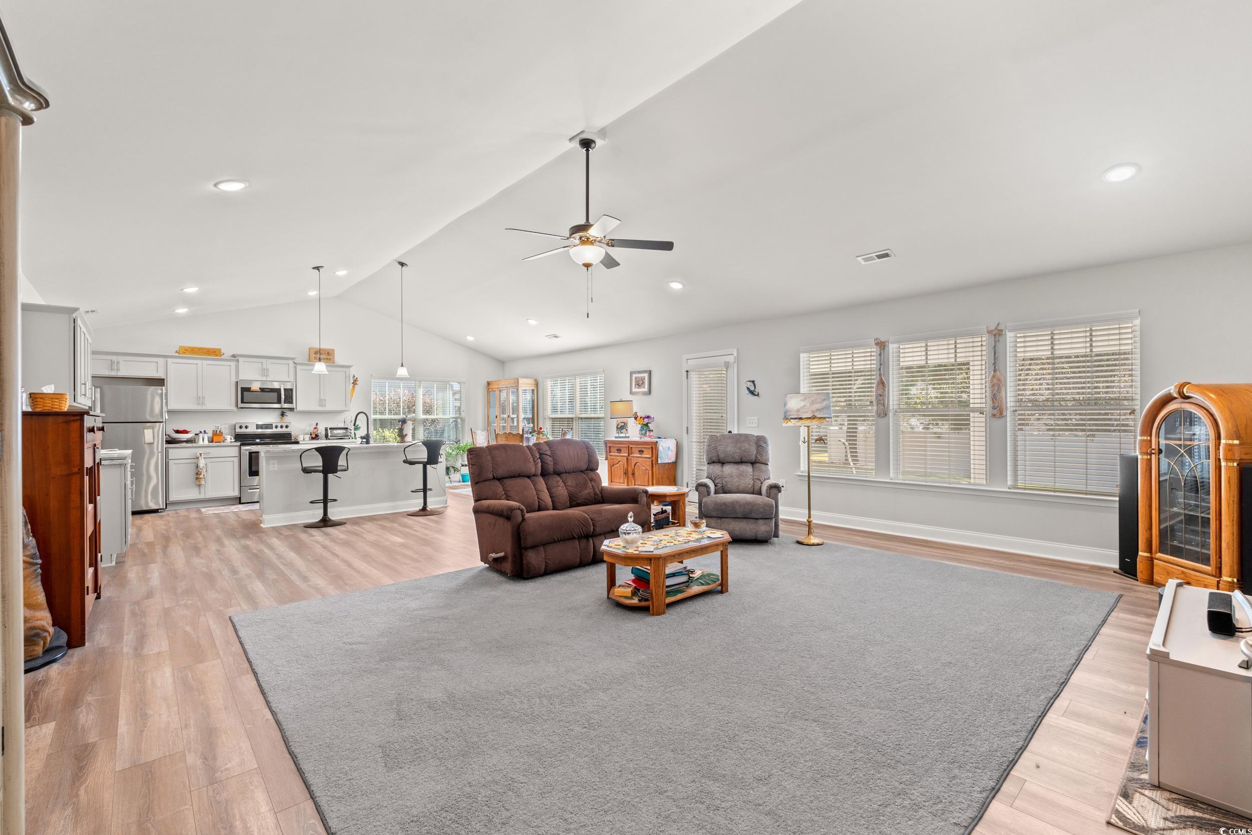 132 Fox Den Drive Murrells Inlet, SC 29576 - Photo 5 of 35 Living room featuring vaulted ceiling, a ceiling fan, light wood-type flooring, and recessed lighting