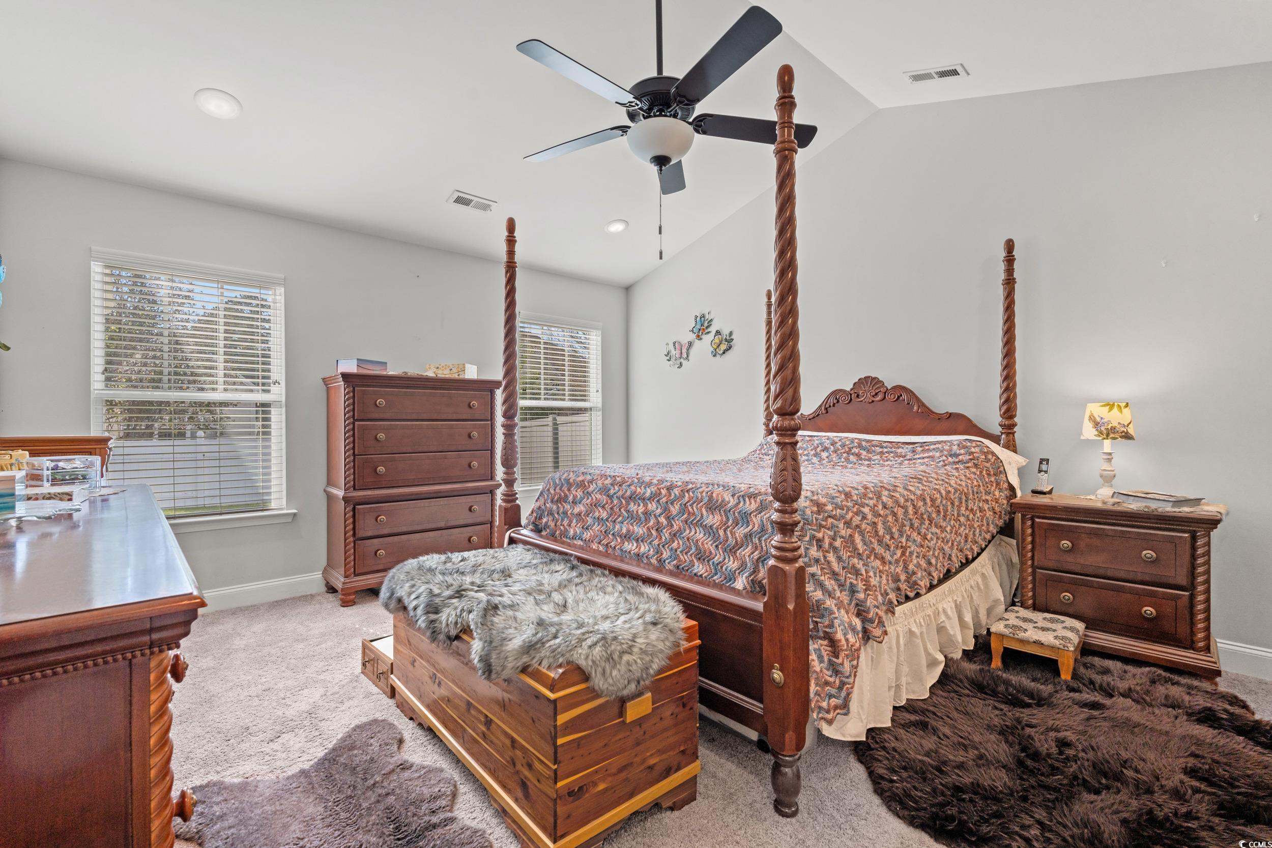 132 Fox Den Drive Murrells Inlet, SC 29576 - Photo 9 of 35 Bedroom with vaulted ceiling, ceiling fan, and carpet