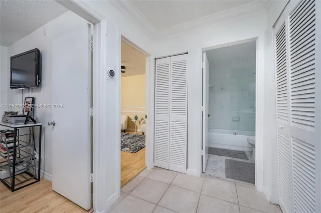 a bathroom with a tub mirror and sink