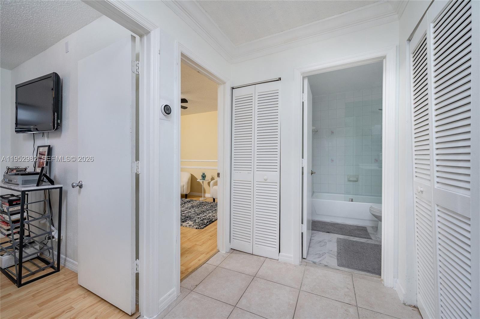 15250 Southwest 134th Place, Unit 102 Miami, FL 33177 - Photo 19 of 23 a bathroom with a tub mirror and sink