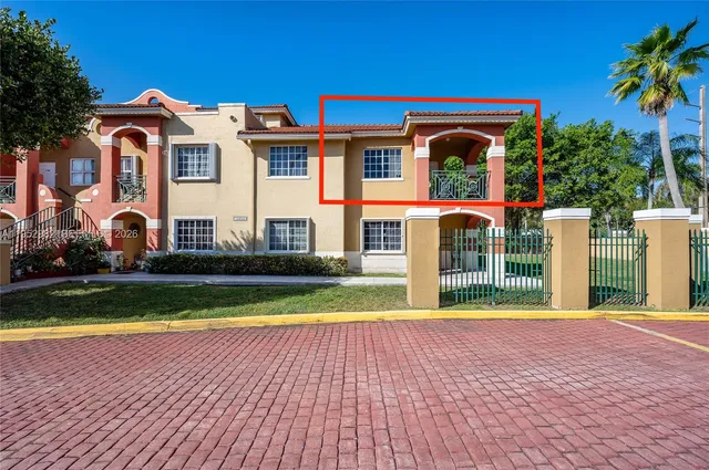 a view of swimming pool with a yard and plants