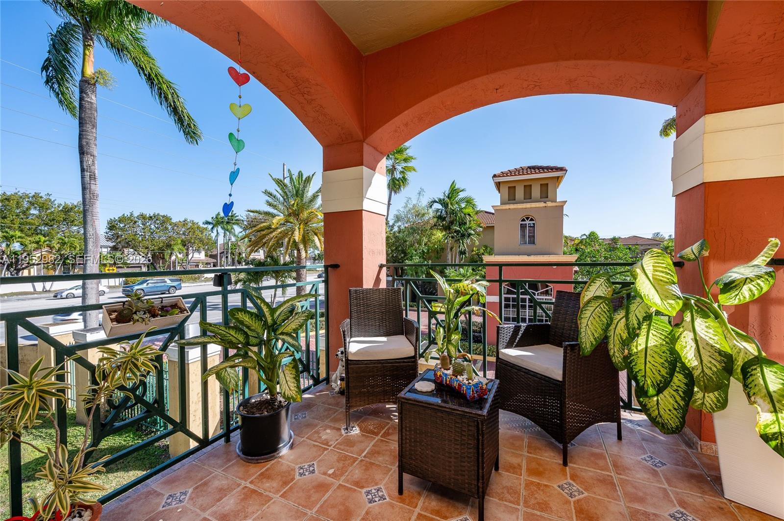 15250 Southwest 134th Place, Unit 102 Miami, FL 33177 - Photo 4 of 23 a view of a chairs and table in the patio