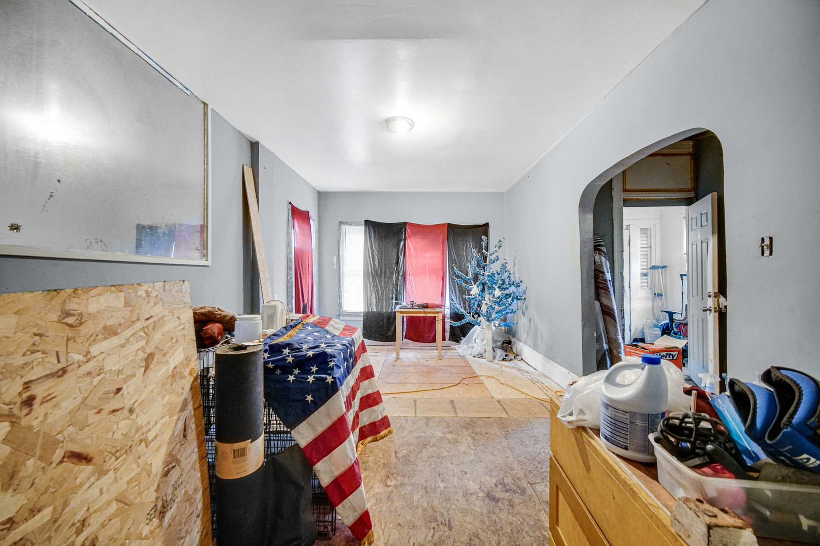 6237 South May Street Chicago, IL 60621 - Photo 3 of 14 a bedroom with furniture and a large mirror