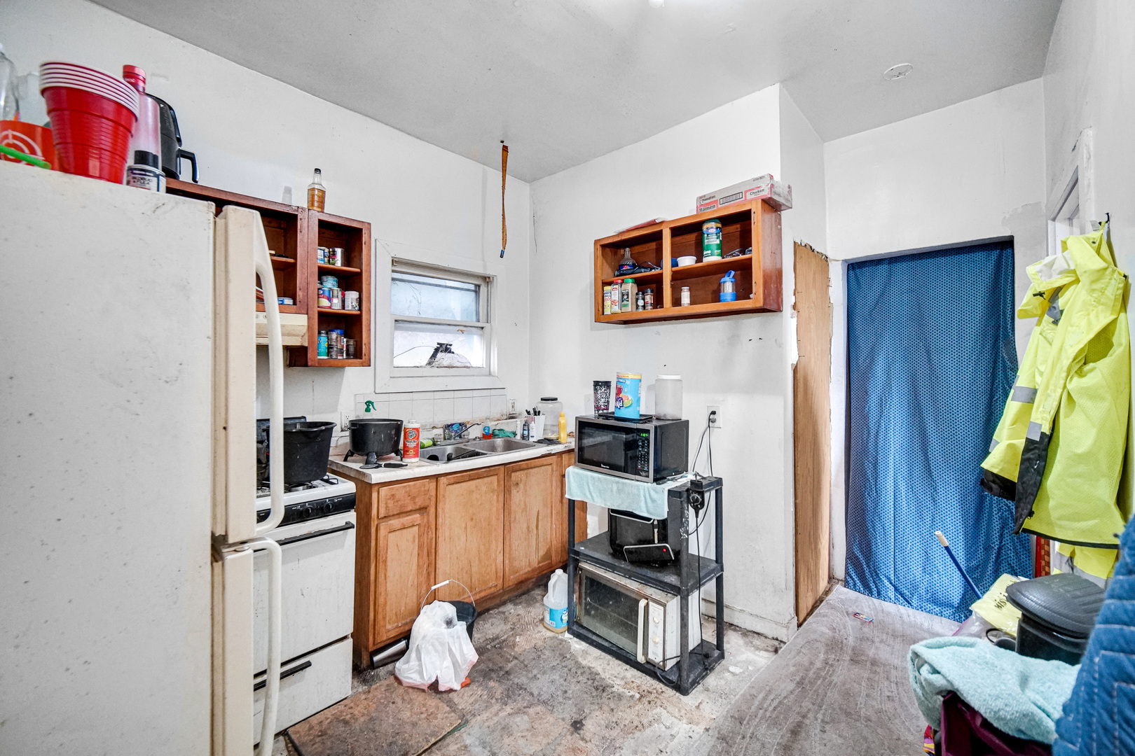 6237 South May Street Chicago, IL 60621 - Photo 5 of 14 a kitchen with stainless steel appliances a stove top oven a refrigerator a sink and a refrigerator