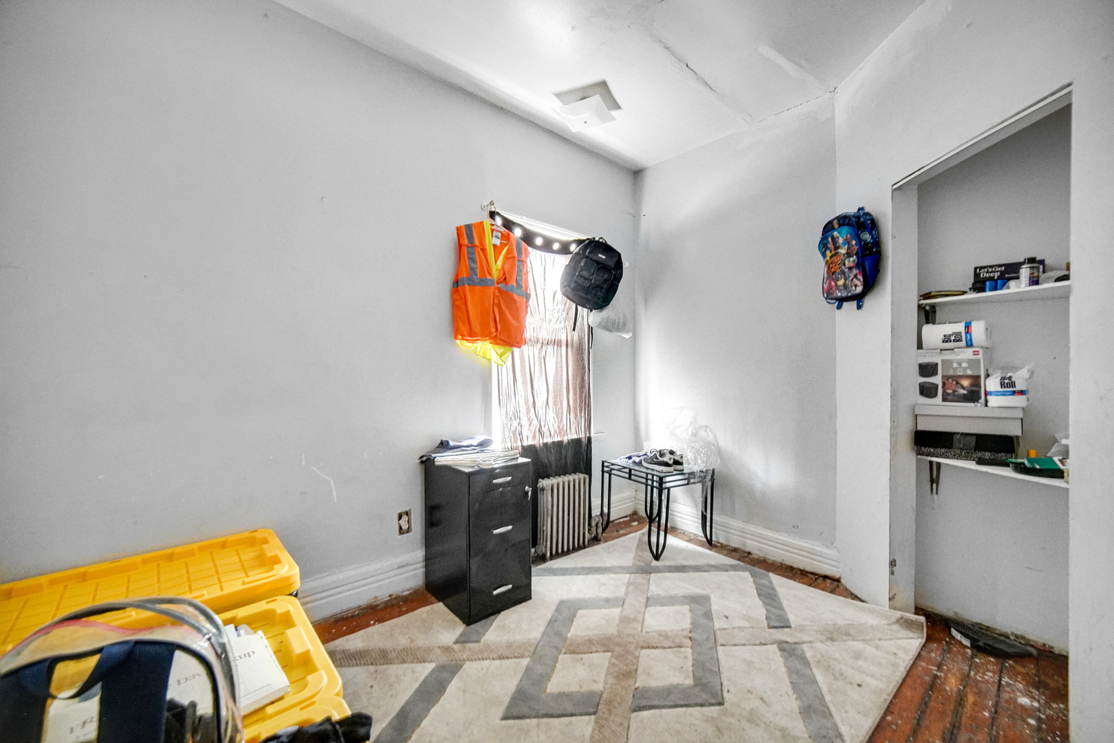 6237 South May Street Chicago, IL 60621 - Photo 8 of 14 a bed room with a bed and a couch