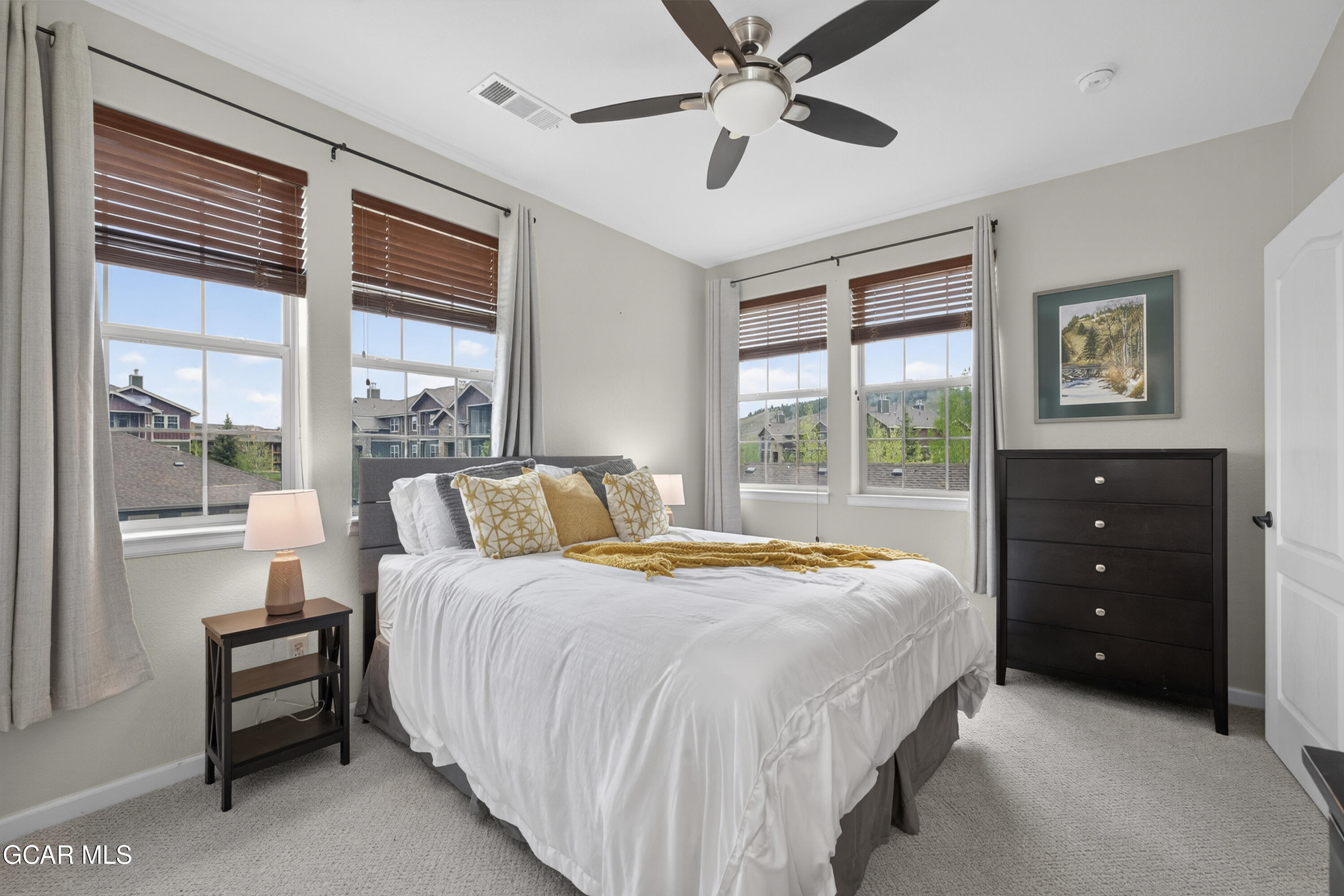 158 Village Road Granby, CO 80446 - Photo 13 of 46 a bedroom with a bed and a large window