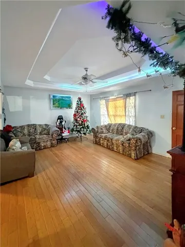 a view of a room with furniture toys and a chandelier