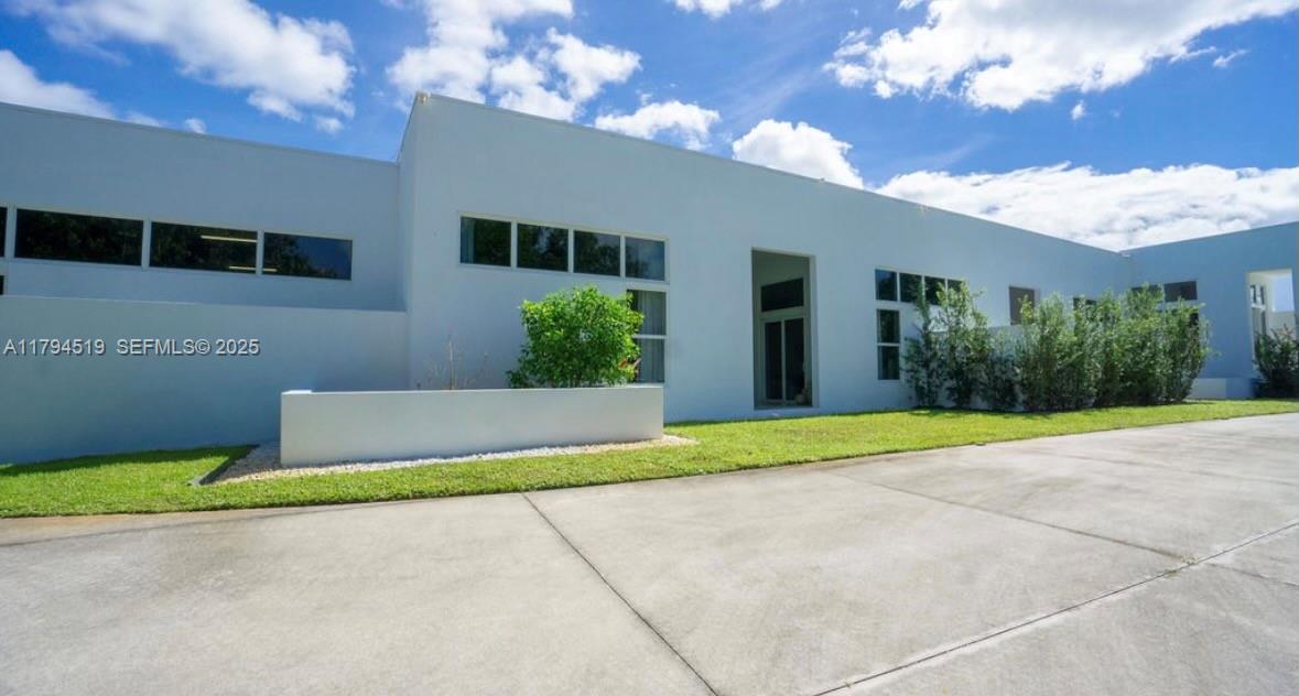 1901 Southeast Ranch Road South Jupiter, FL 33478 - Photo 35 of 53 a house view with a garden space