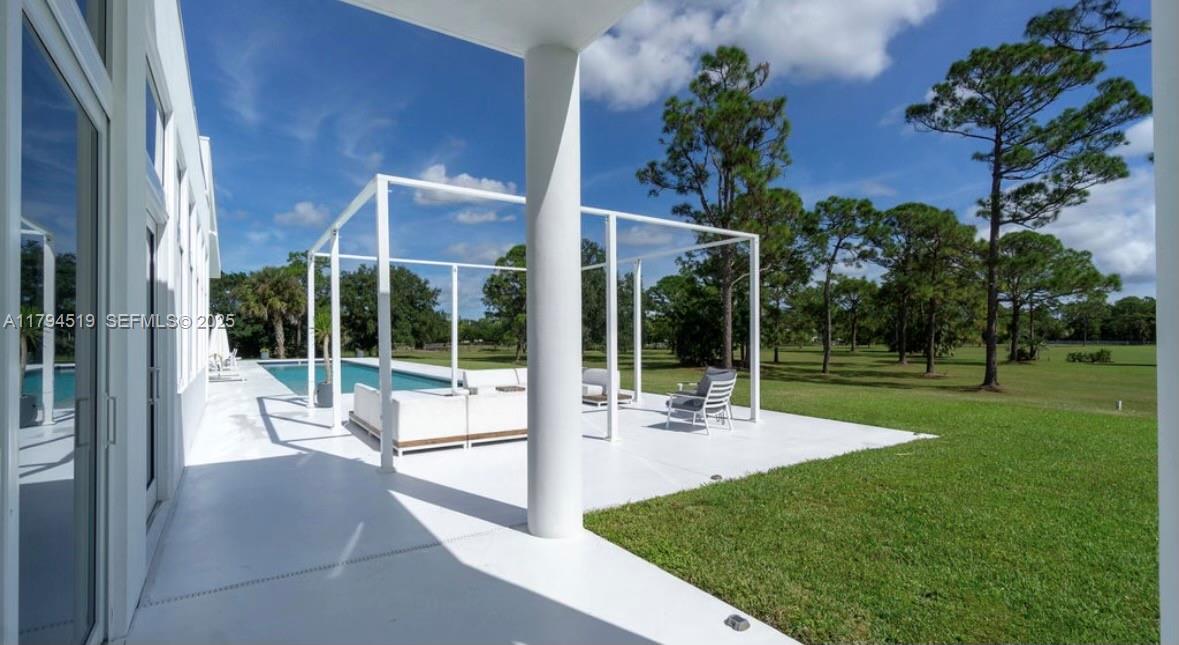 1901 Southeast Ranch Road South Jupiter, FL 33478 - Photo 39 of 53 a view of a house with backyard and sitting area