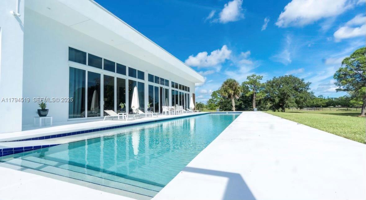 1901 Southeast Ranch Road South Jupiter, FL 33478 - Photo 45 of 53 a view of swimming pool with a backyard